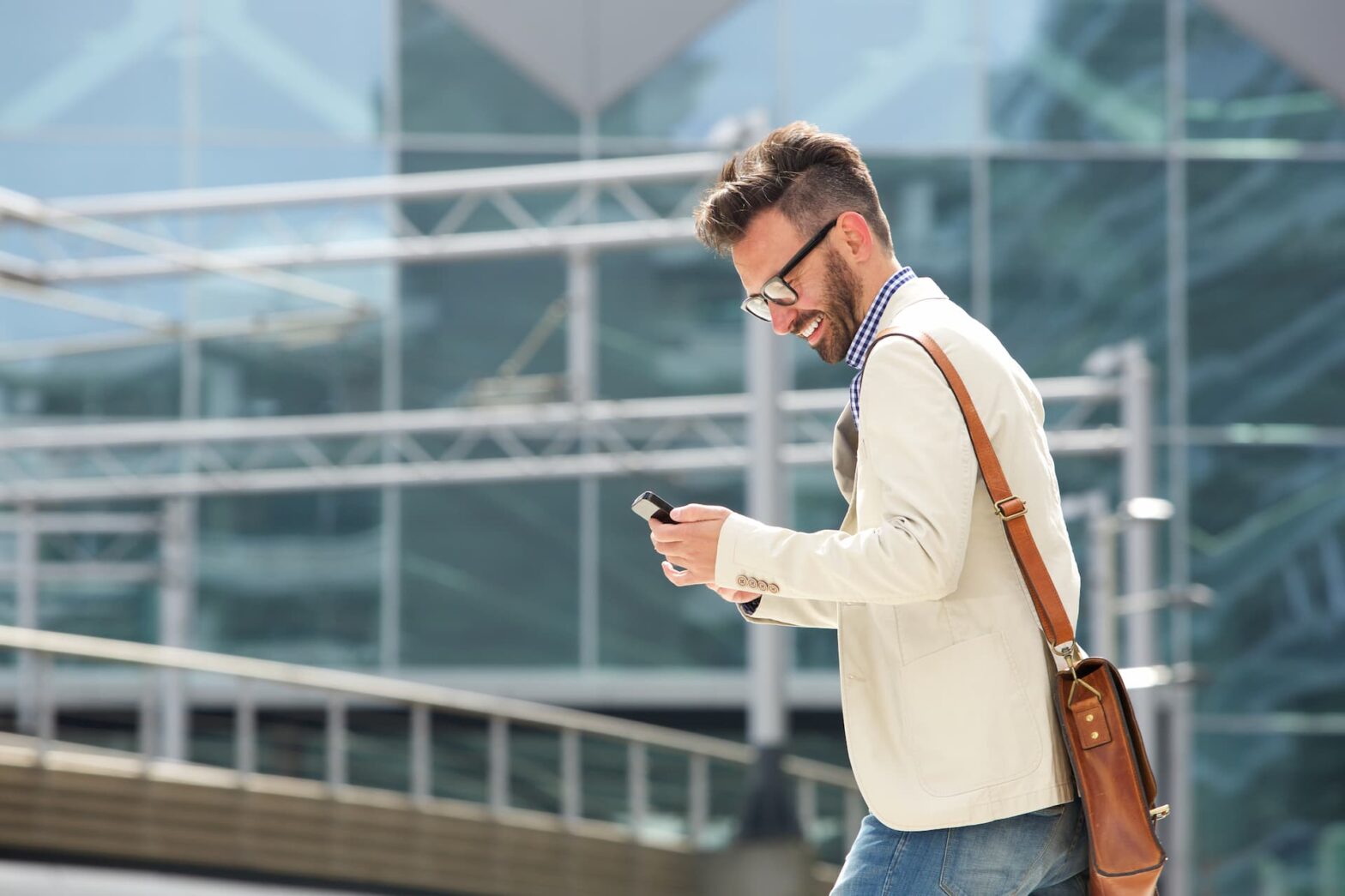 A man receiving a text from a newly registered 10DLC A2P campaign that is registered with Tychron.